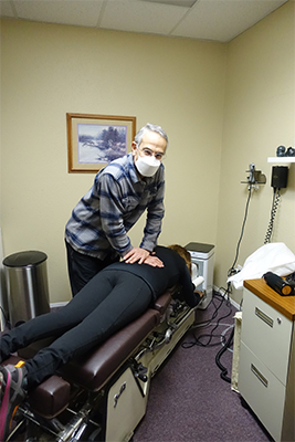 Chiropractor Silverdale WA Scott Siegel Adjusting Patient With Back Pain