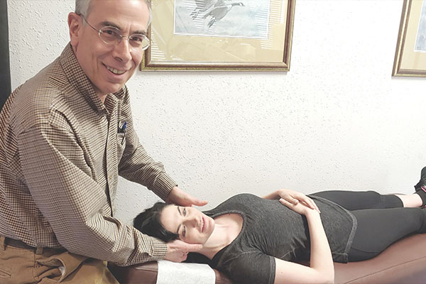 Chiropractor Silverdale WA Scott Siegel Adjusting Patient With Neck Pain