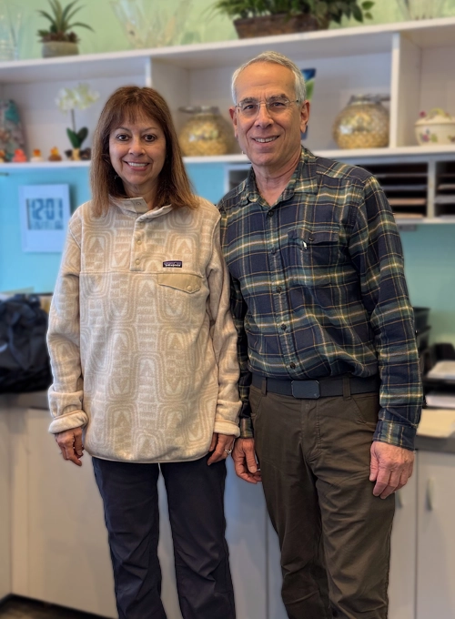 Scott Siegel smiling with his wife.