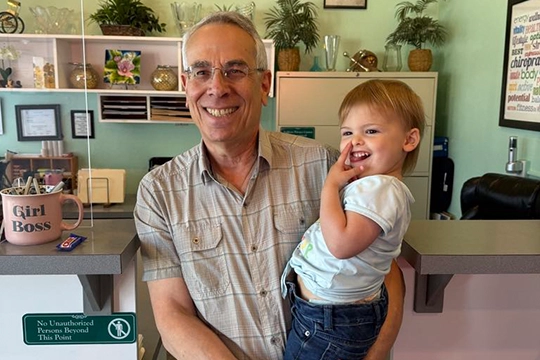 Chiropractor Silverdale WA Scott Siegel With a Child